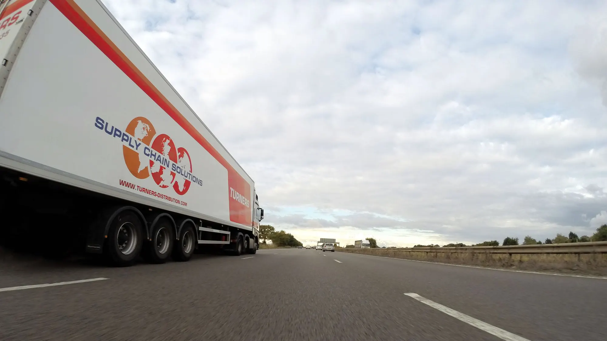 Commercial refrigerated truck travelling on a highway