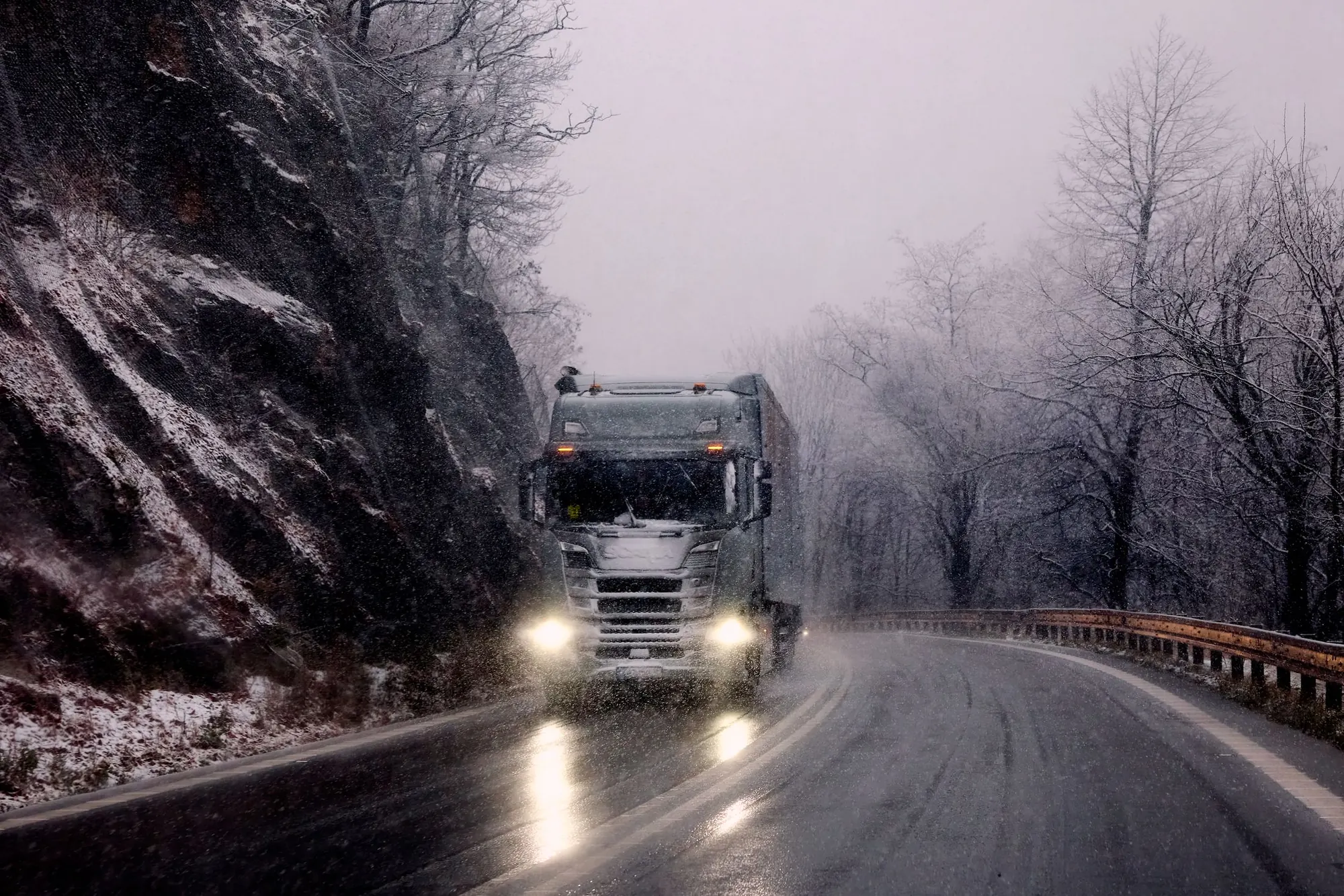 Refrigerated truck travelling through a New York winter route