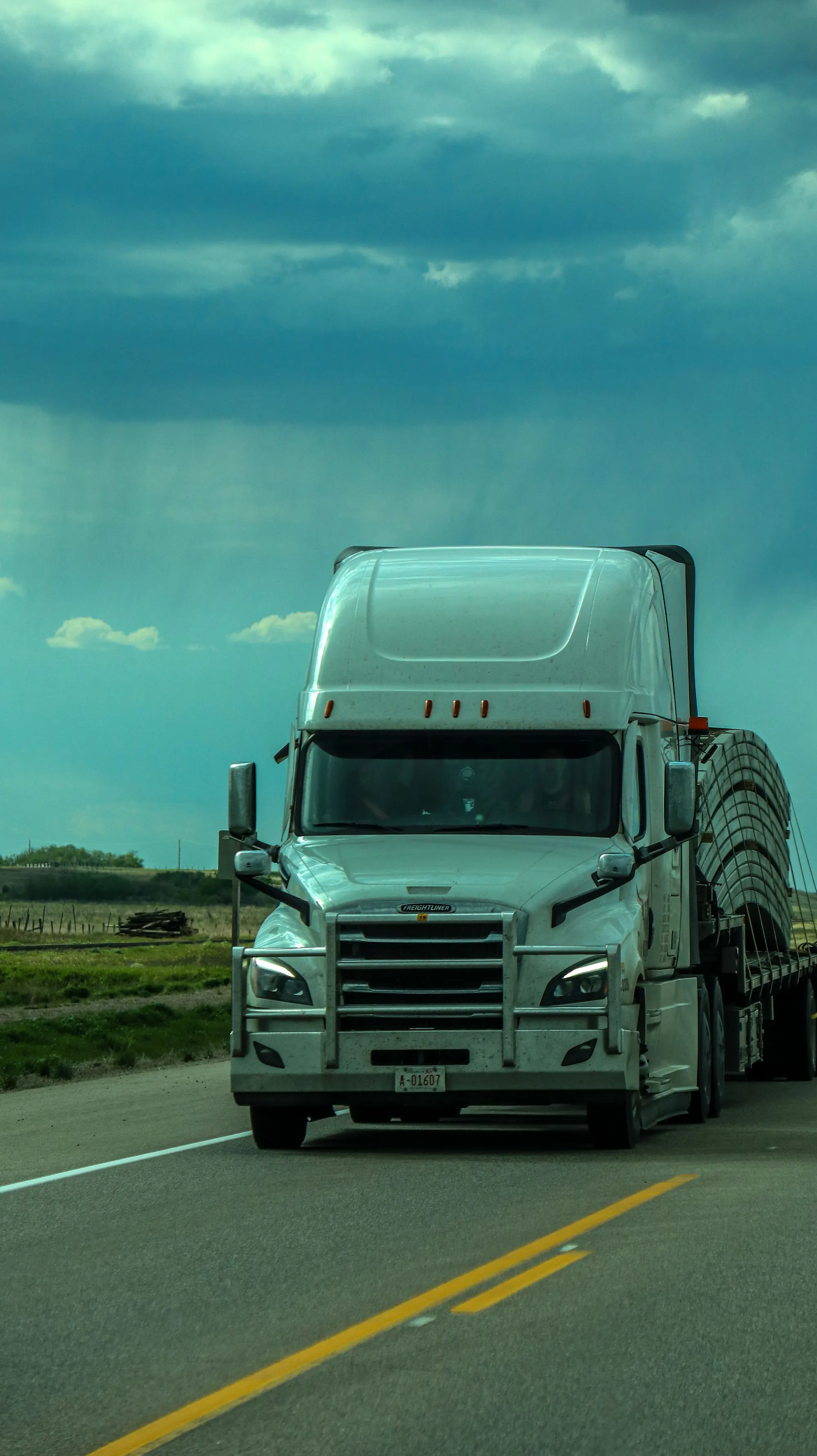 White refrigerated semi-truck travelling through Pennsylvania